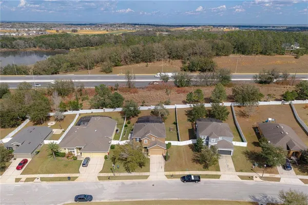 an aerial view of residential houses with outdoor space