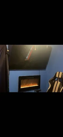 a view of house with backyard space and seating area