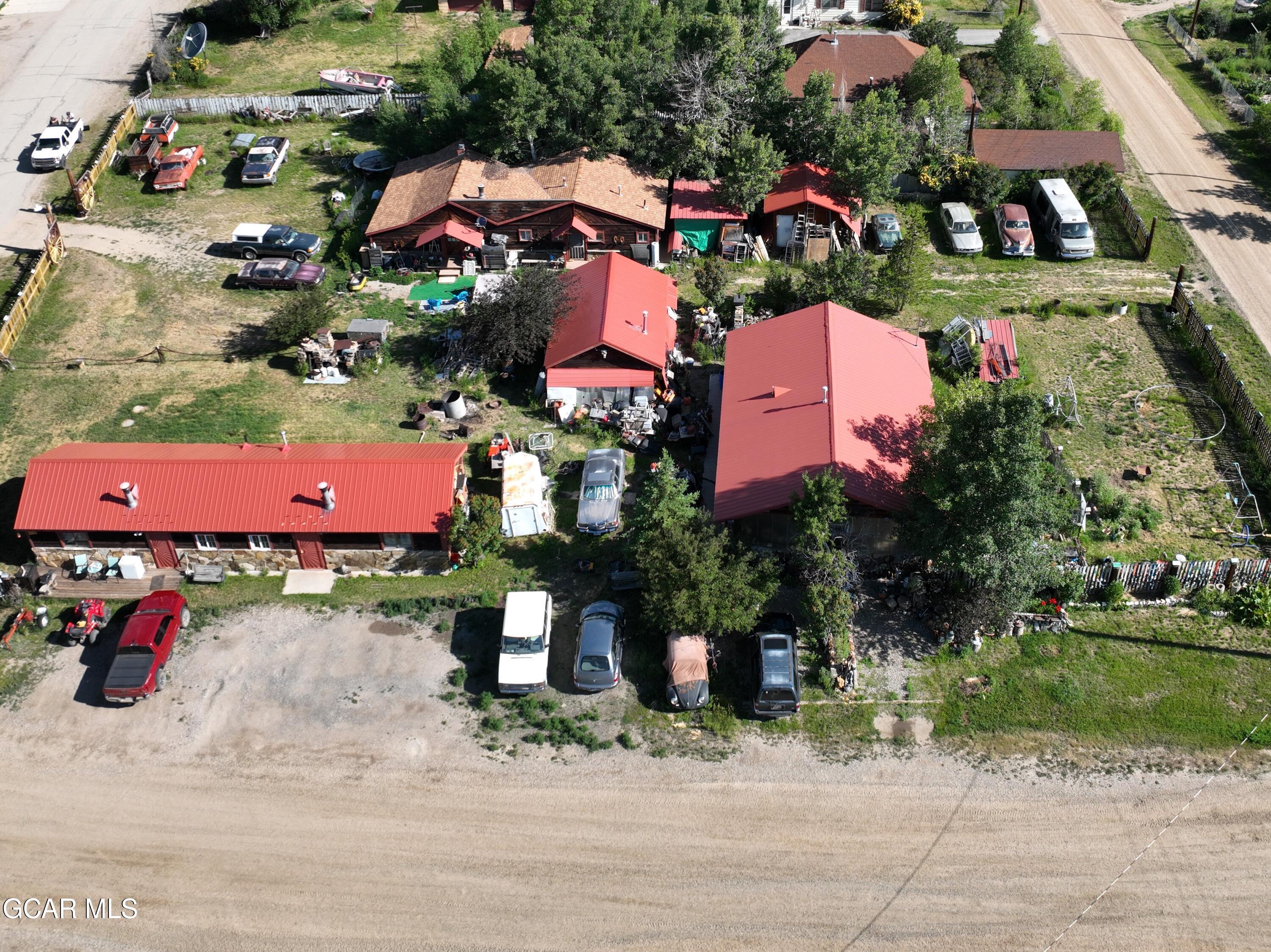 an aerial view of a houses with outdoor space