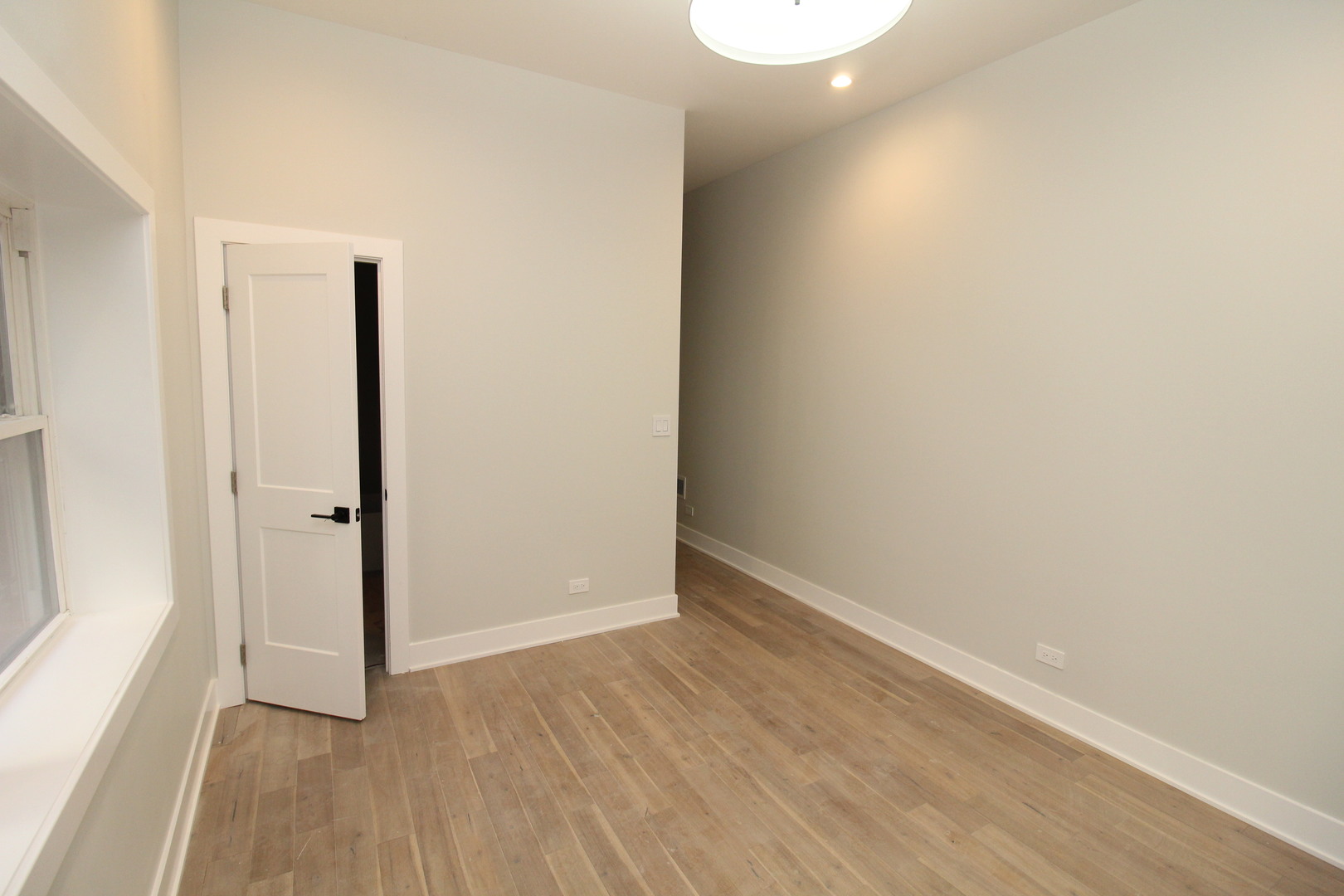64 East Cedar Street, Unit 2R Chicago, IL 60611 - Photo 15 of 17 a view of an empty room with closet and a window
