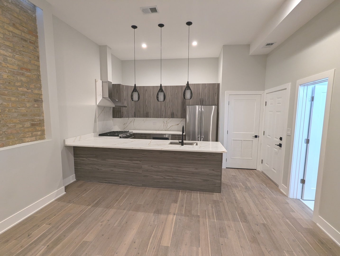 64 East Cedar Street, Unit 2R Chicago, IL 60611 - Photo 5 of 17 a view of kitchen with wooden floor