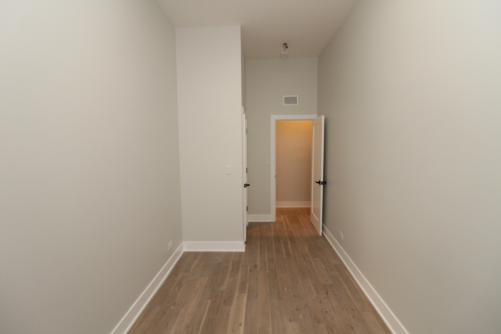 64 East Cedar Street, Unit 2R Chicago, IL 60611 - Photo 9 of 17 a view of a hallway with wooden floor
