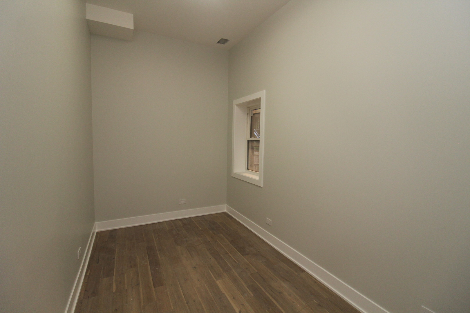 64 East Cedar Street, Unit 2R Chicago, IL 60611 - Photo 10 of 17 a view of a small space with wooden floor and a window