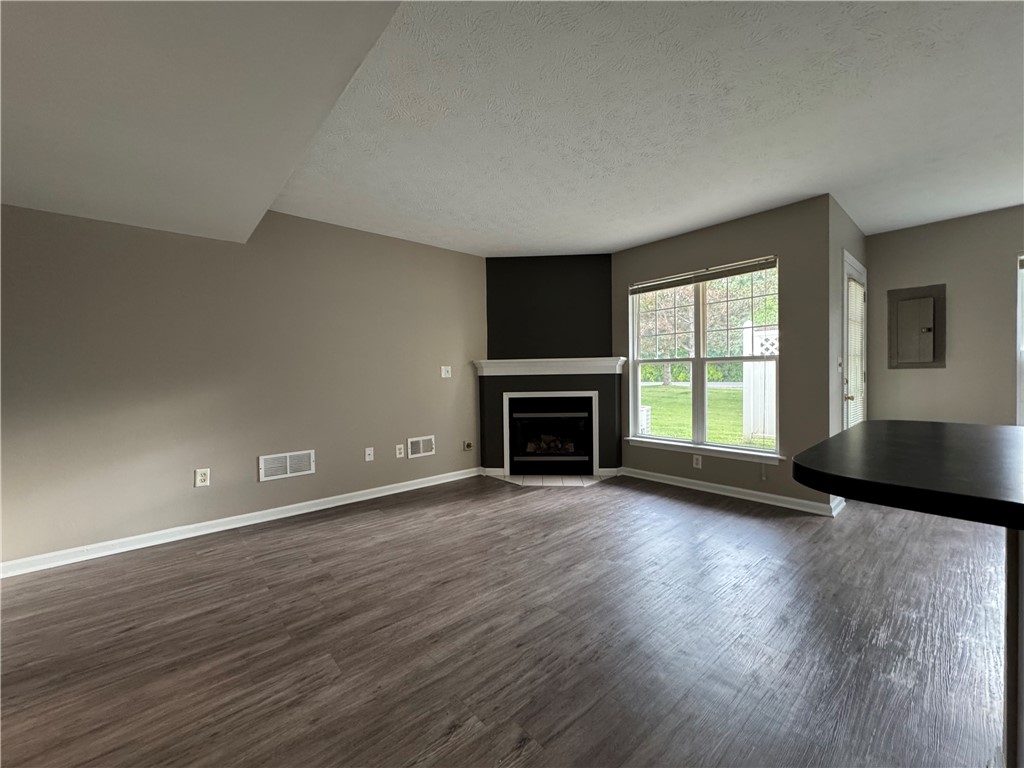 778 Royal Sunset Drive Webster, NY 14580 - Photo 17 of 38 View of typical great room with cozy fireplace