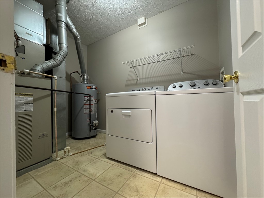 778 Royal Sunset Drive Webster, NY 14580 - Photo 27 of 38 Typical second floor laundry room with full-size w