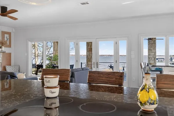 a living room with furniture and large windows