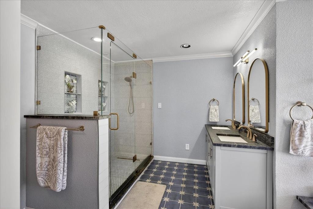 353 Winding Shore Tool, TX 75143 - Photo 20 of 35 a bathroom with a double vanity sink a mirror and a shower