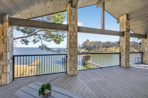a view of a balcony with wooden floor