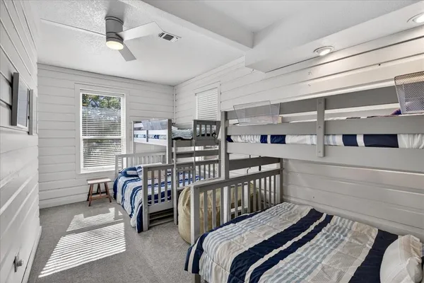 a bedroom with furniture and a window