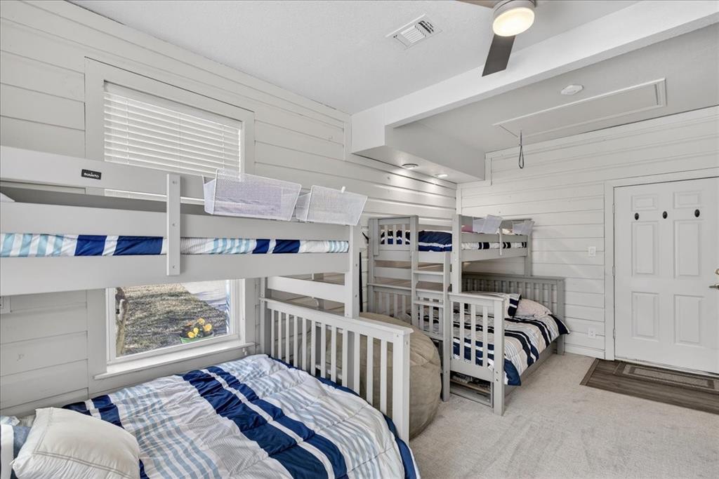 353 Winding Shore Tool, TX 75143 - Photo 28 of 35 a bedroom with furniture and a baby crib