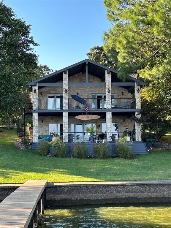 353 Winding Shore Tool, TX 75143 - Photo 3 of 35 a view of a house with a swimming pool and a yard