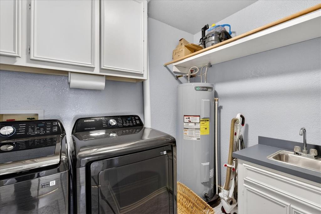 353 Winding Shore Tool, TX 75143 - Photo 31 of 35 a utility room with dryer and washer