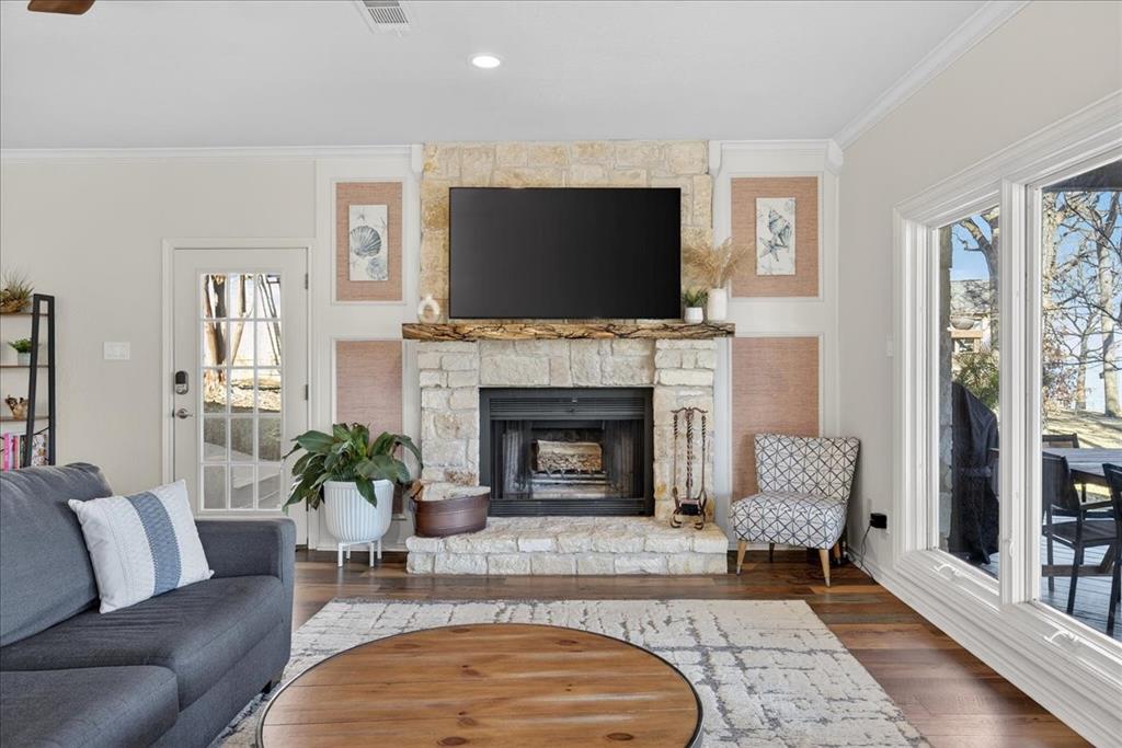 353 Winding Shore Tool, TX 75143 - Photo 7 of 35 a living room with furniture a flat screen tv and a fireplace