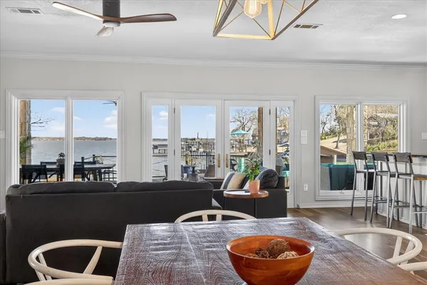 a living room with furniture a rug and a large window