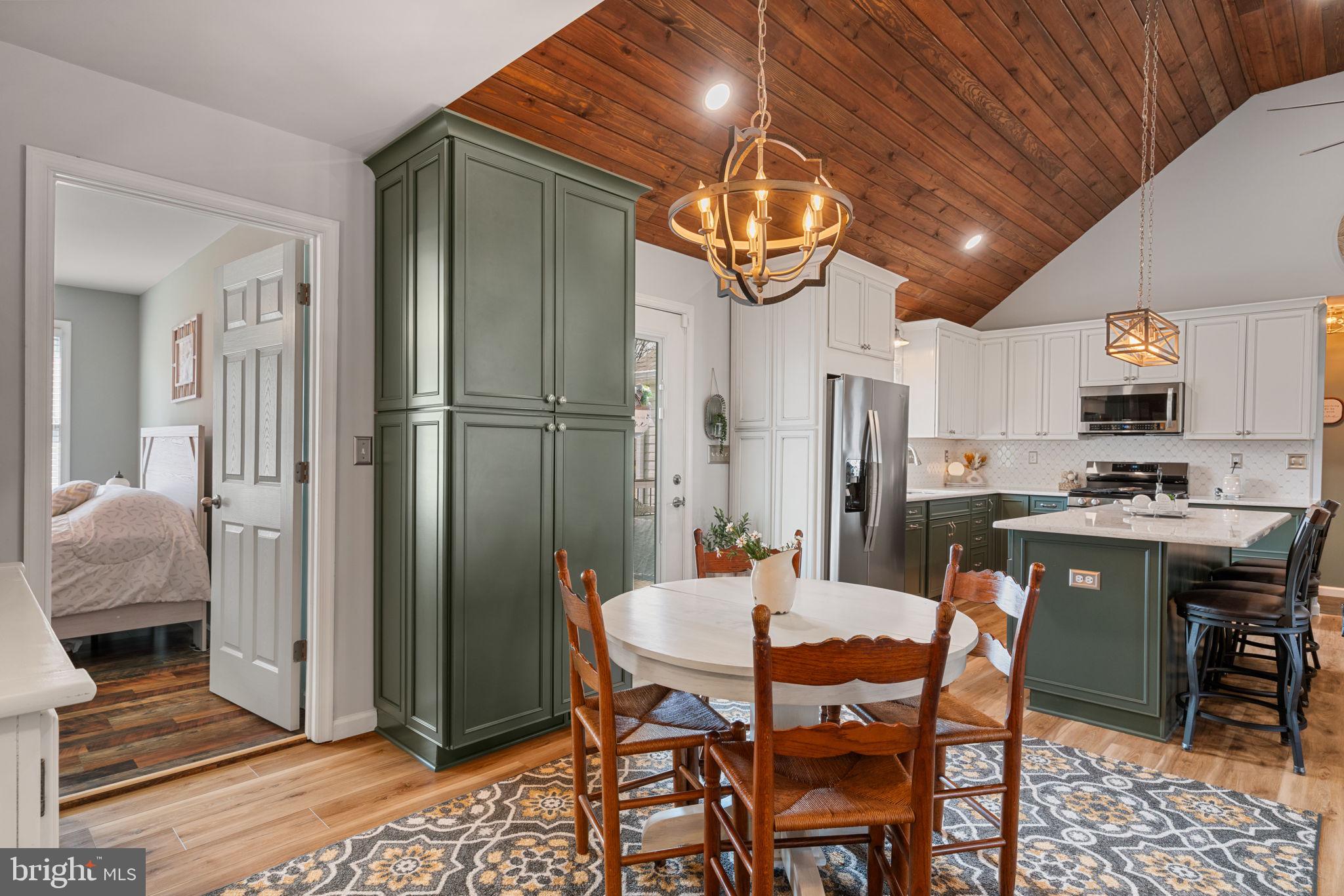 37 Pendleton Road Fredericksburg, VA 22405 - Photo 16 of 43 a view of a dining room with furniture a chandelier and wooden floor