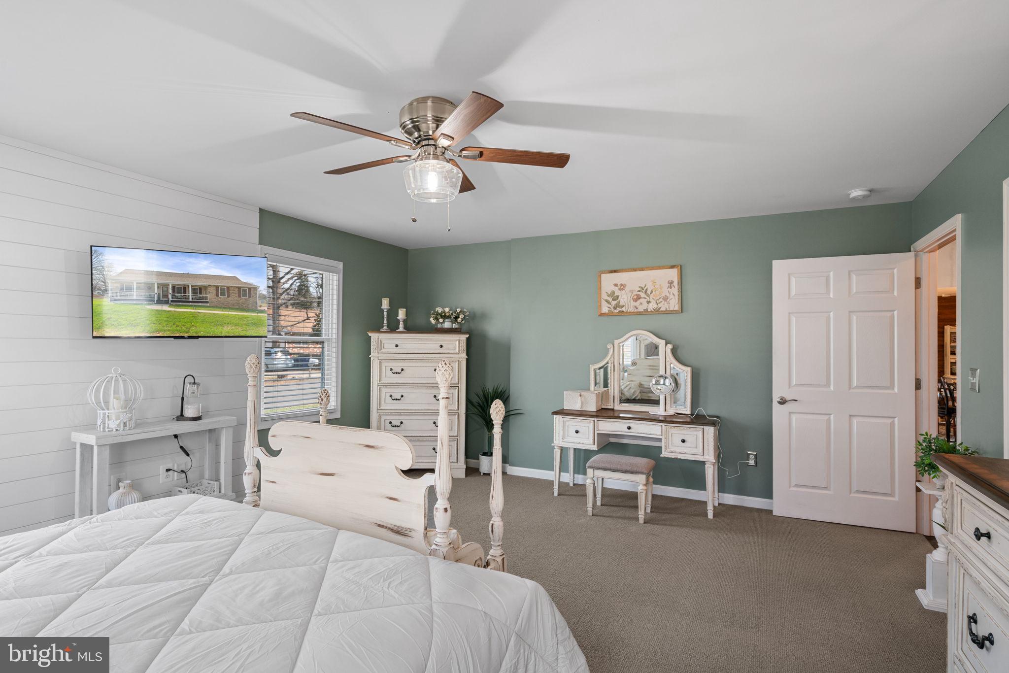 37 Pendleton Road Fredericksburg, VA 22405 - Photo 20 of 43 a bedroom with a bed and a chandelier