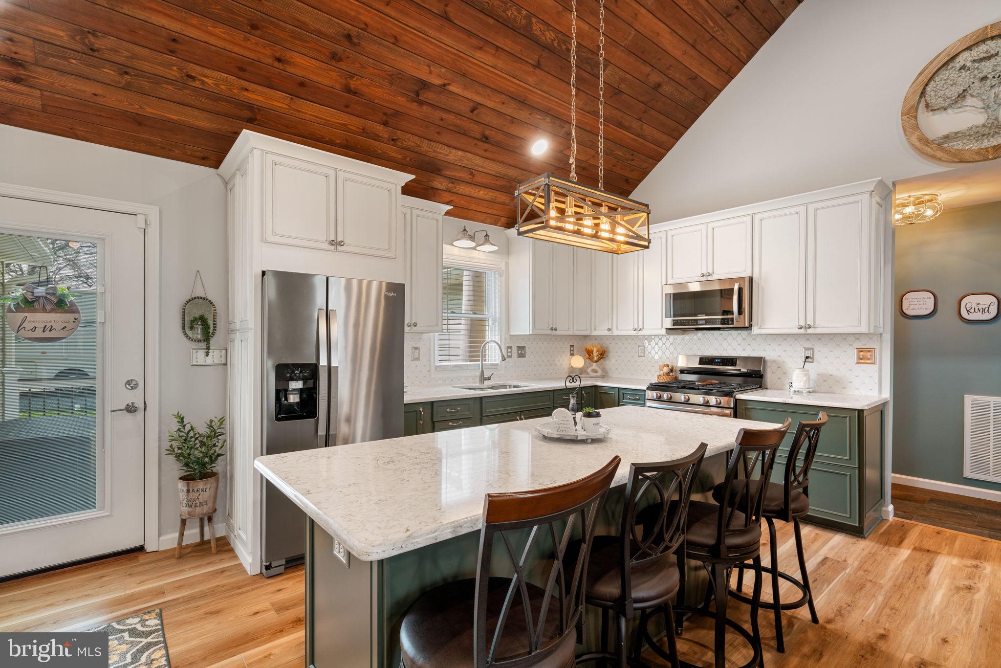 37 Pendleton Road Fredericksburg, VA 22405 - Photo 5 of 43 a kitchen with stainless steel appliances a table chairs and a refrigerator