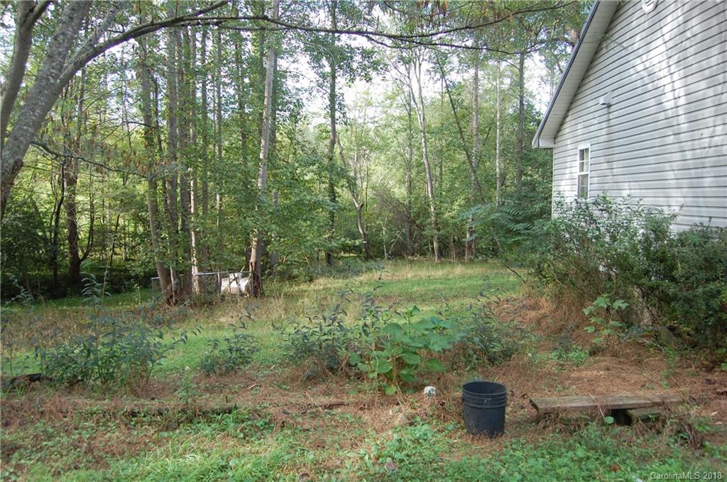 385 Pipers Neck Rutherfordton, NC 28139 - Photo 2 of 13 a backyard of a house with lots of green space