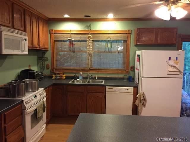 385 Pipers Neck Rutherfordton, NC 28139 - Photo 13 of 13 a kitchen with stainless steel appliances granite countertop a refrigerator a stove a sink and a microwave