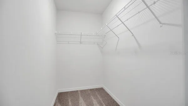 a view of a room with racks on the wall