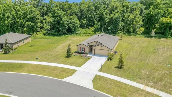a view of a swimming pool with an outdoor space and seating area