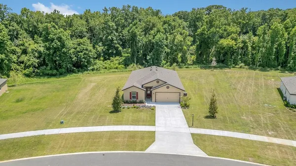 a view of a swimming pool with a yard