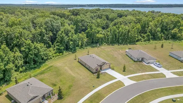 a view of a balcony with an outdoor seating and water view