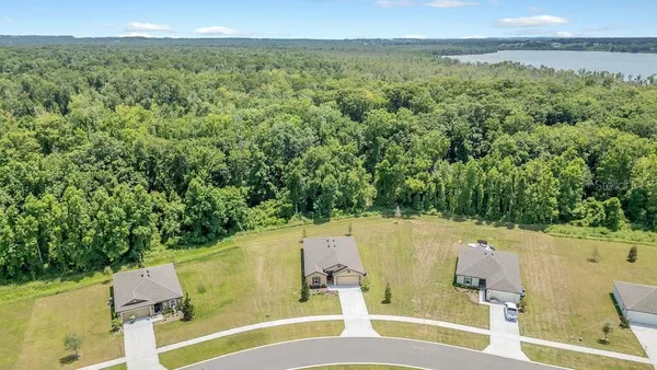 a view of a swimming pool with a yard