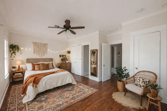 a bedroom with a bed and a chair