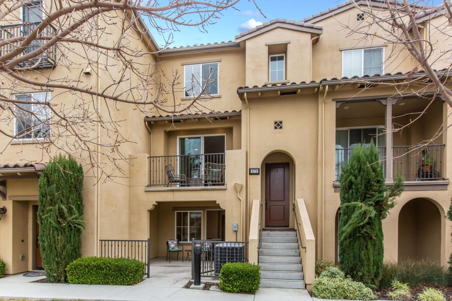 a front view of a house with garden