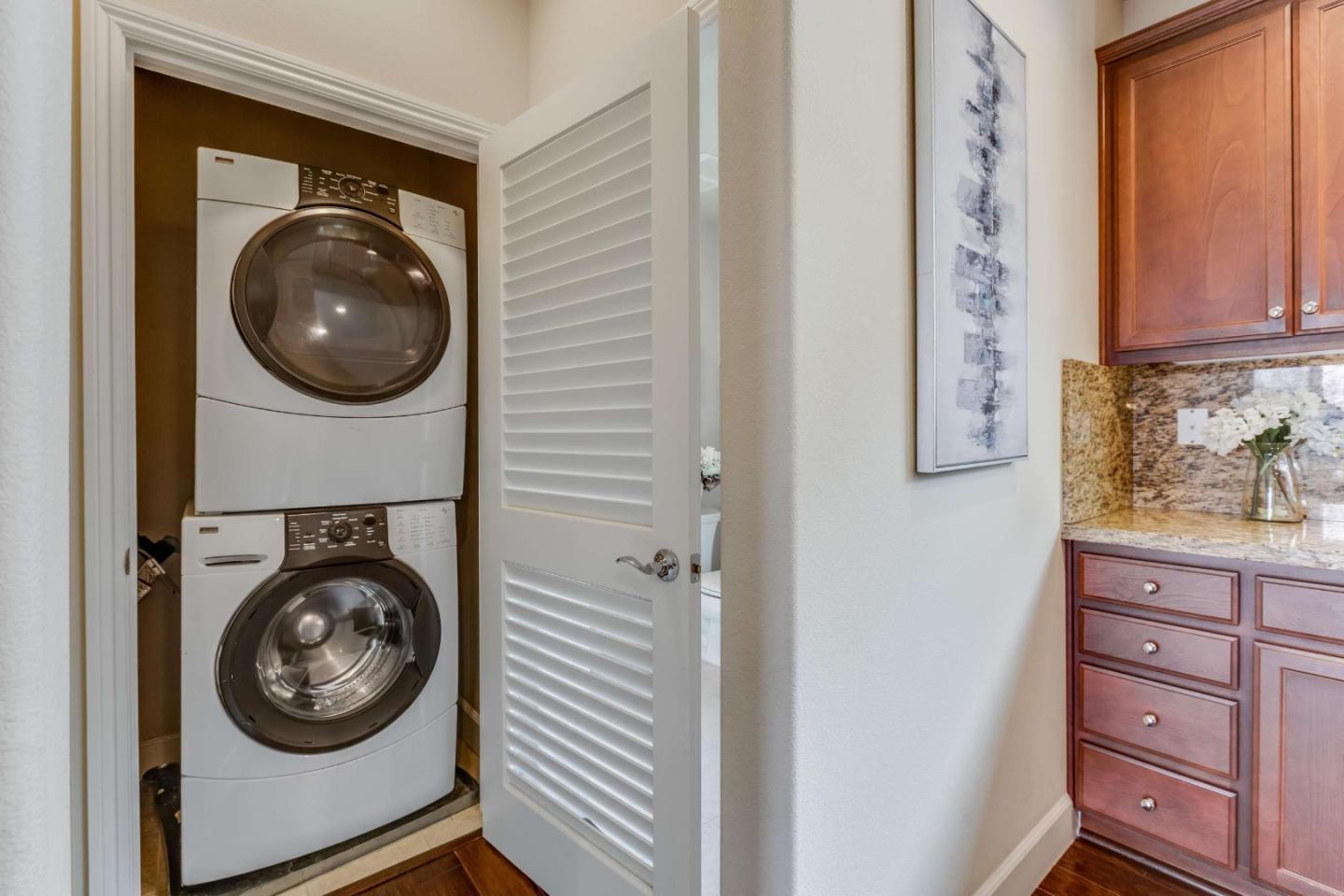 579 Holthouse Terrace Sunnyvale, CA 94087 - Photo 16 of 37 a view of a hallway with washer and dryer
