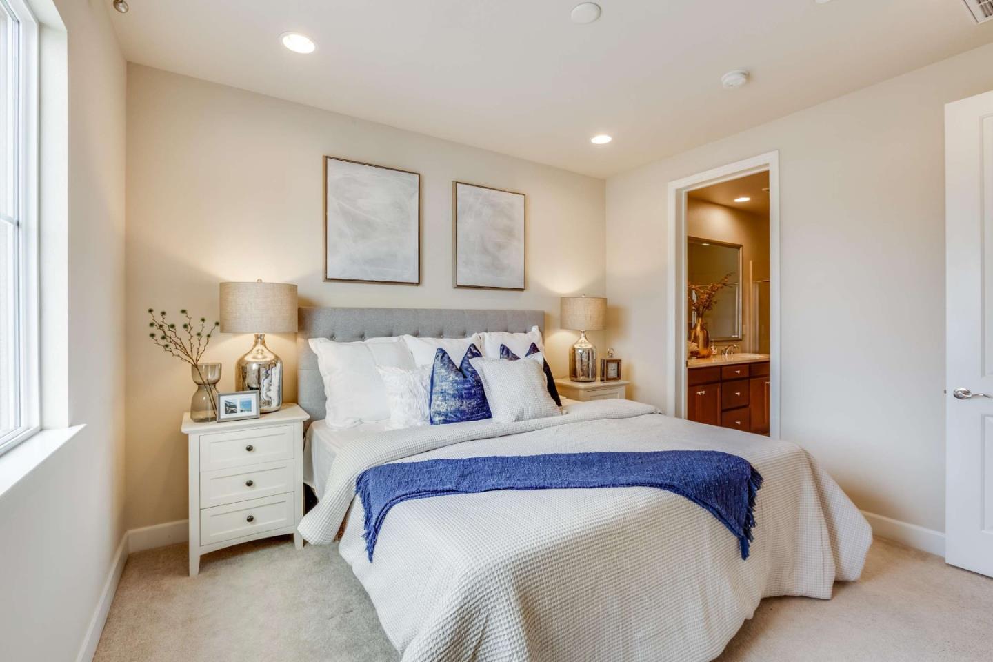 579 Holthouse Terrace Sunnyvale, CA 94087 - Photo 19 of 37 a bedroom with a large bed and a window