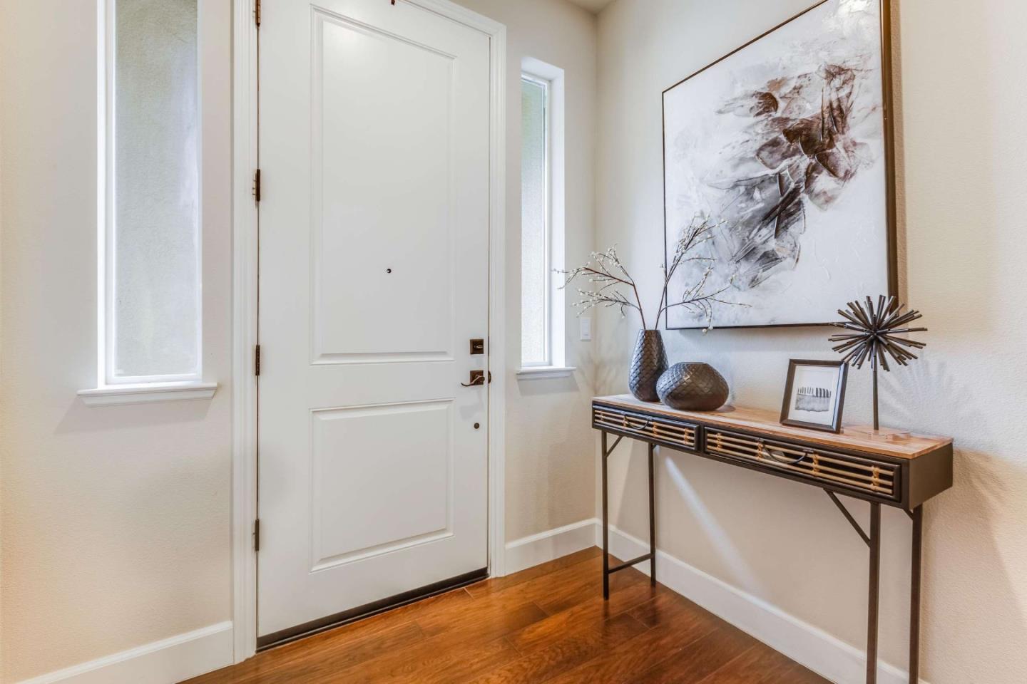579 Holthouse Terrace Sunnyvale, CA 94087 - Photo 2 of 37 a view of front door with chair and wooden floor