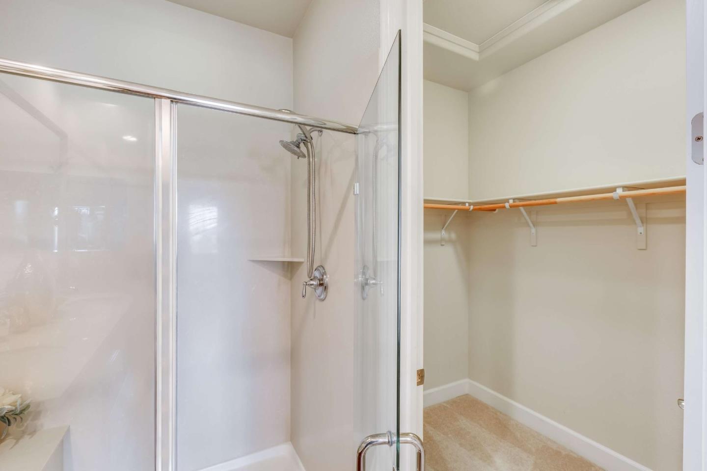579 Holthouse Terrace Sunnyvale, CA 94087 - Photo 21 of 37 a bathroom with a glass shower door