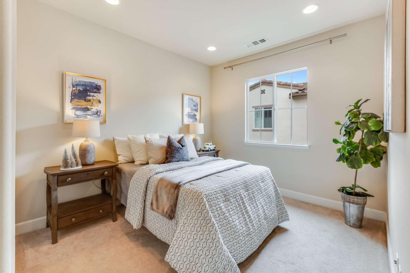 579 Holthouse Terrace Sunnyvale, CA 94087 - Photo 22 of 37 a spacious bedroom with a bed and a potted plant