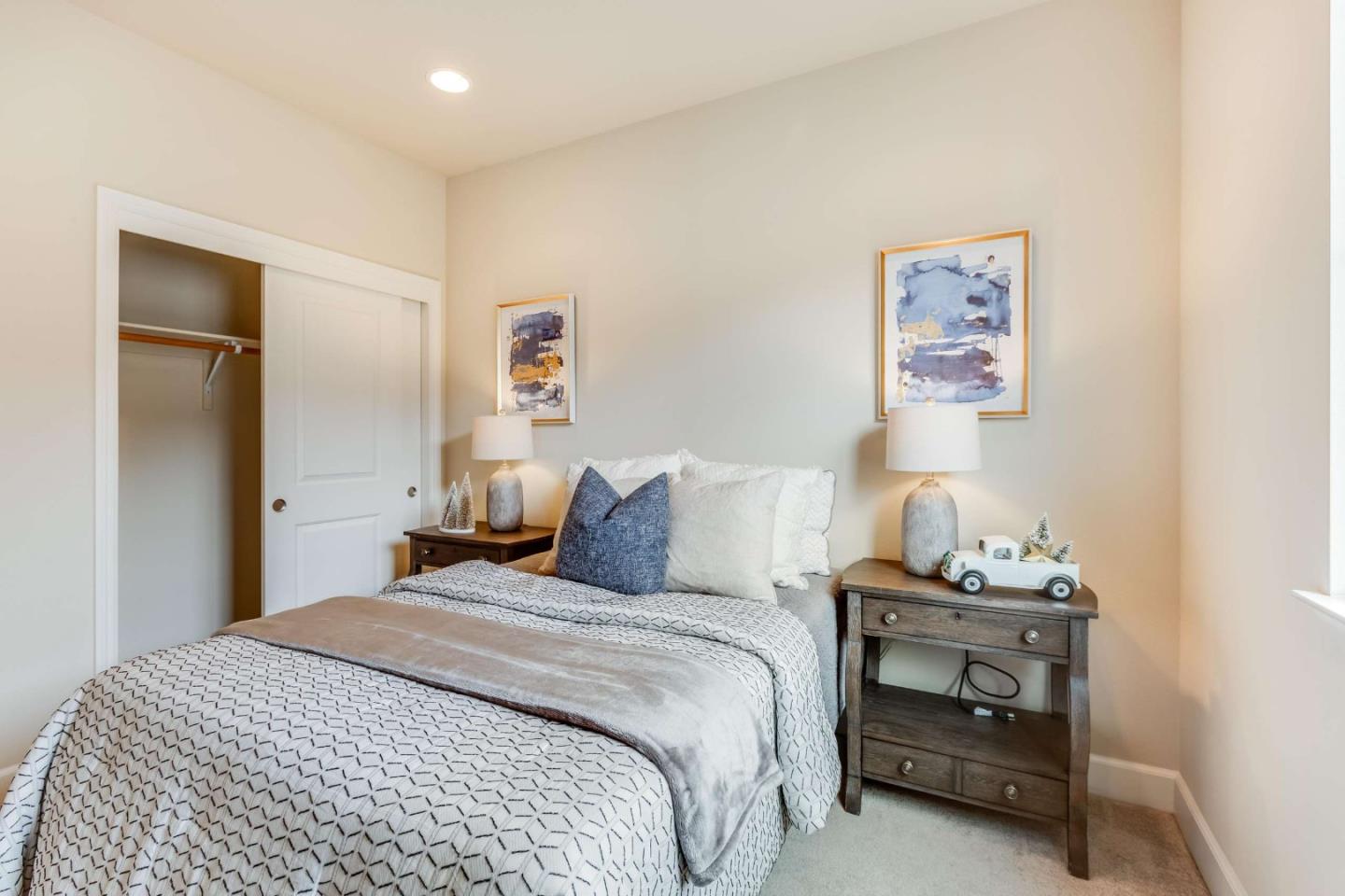 579 Holthouse Terrace Sunnyvale, CA 94087 - Photo 23 of 37 a bedroom with a bed and a lamp on a dresser