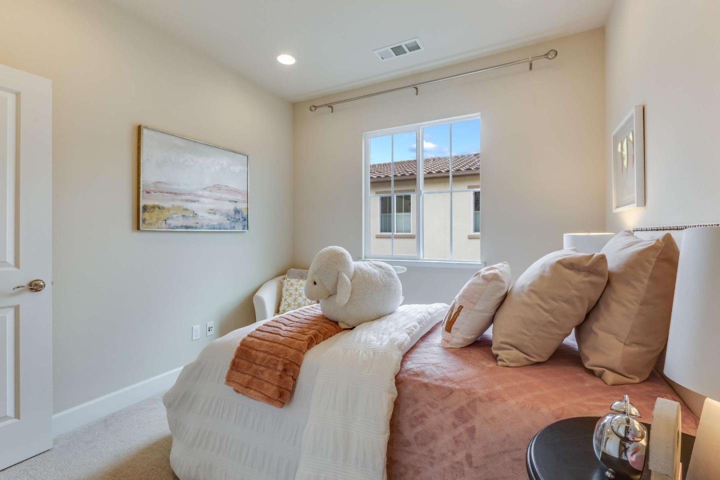 579 Holthouse Terrace Sunnyvale, CA 94087 - Photo 25 of 37 a bedroom with a bed and a window