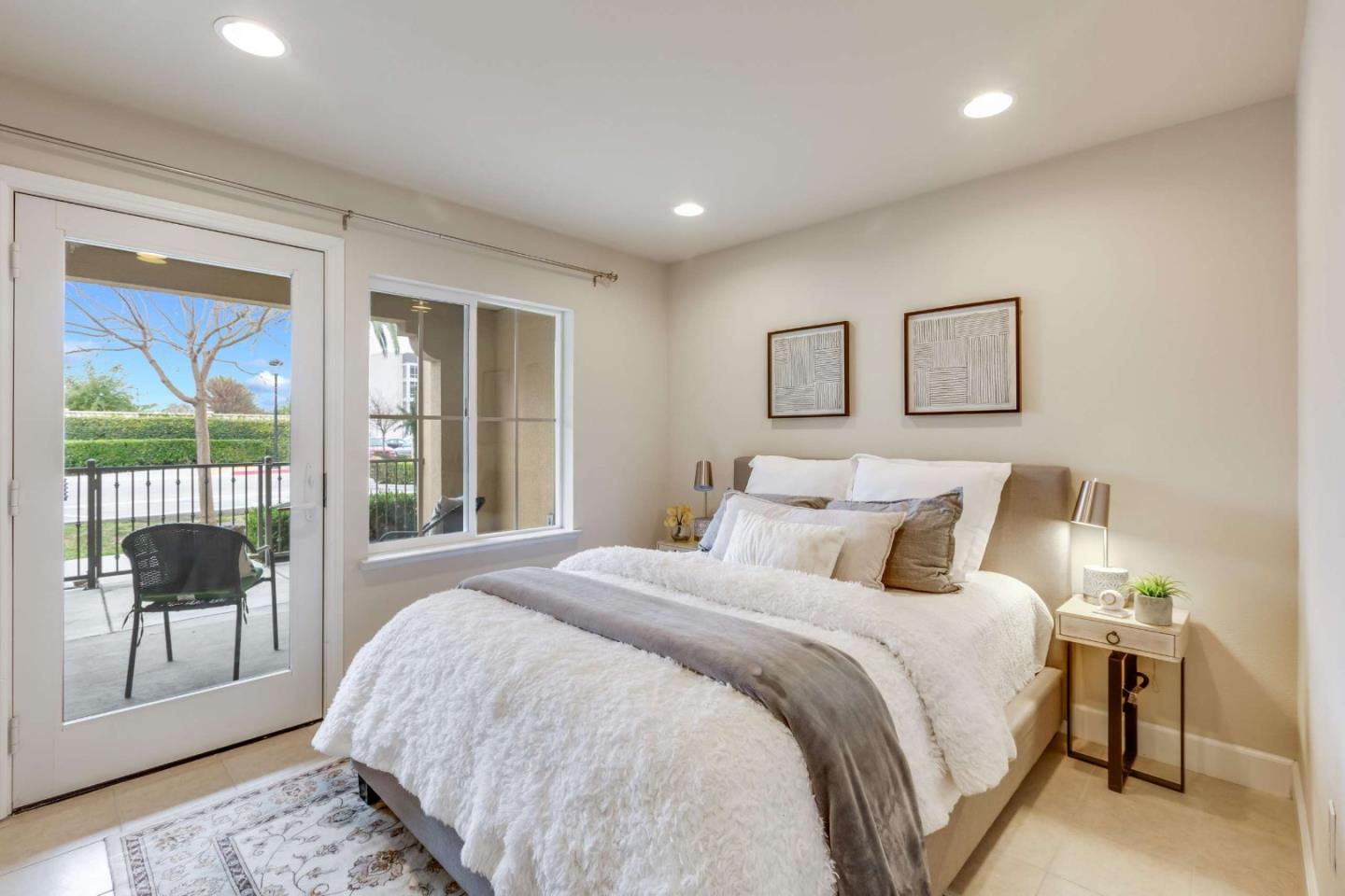579 Holthouse Terrace Sunnyvale, CA 94087 - Photo 27 of 37 a bedroom with a large bed and a large window
