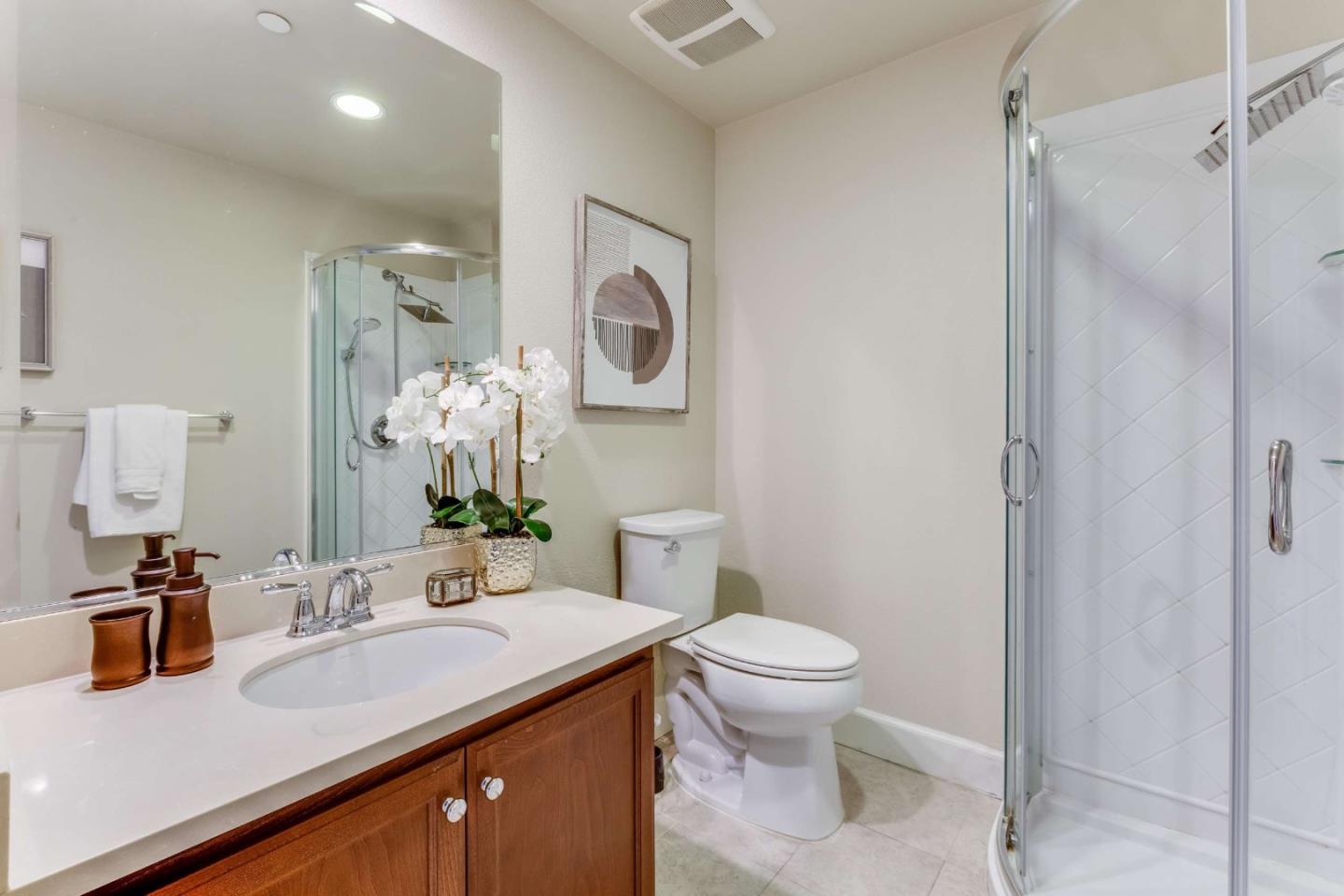 579 Holthouse Terrace Sunnyvale, CA 94087 - Photo 29 of 37 a bathroom with a sink a toilet and shower