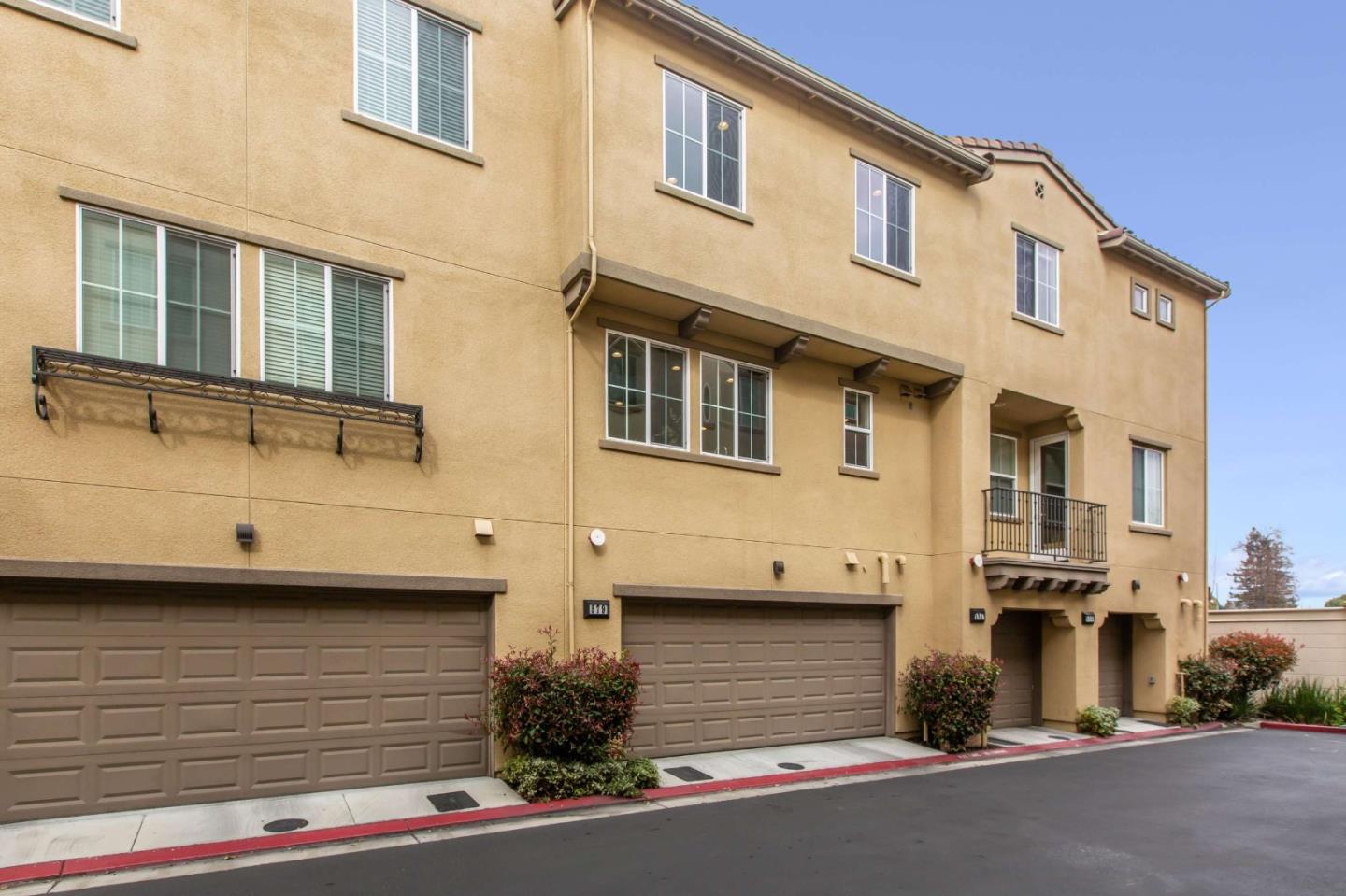 579 Holthouse Terrace Sunnyvale, CA 94087 - Photo 31 of 37 a view of a street with a car parked on the road