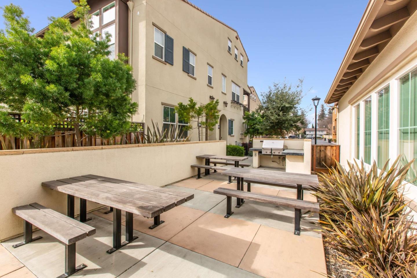579 Holthouse Terrace Sunnyvale, CA 94087 - Photo 37 of 37 a view of a patio with a table and chairs
