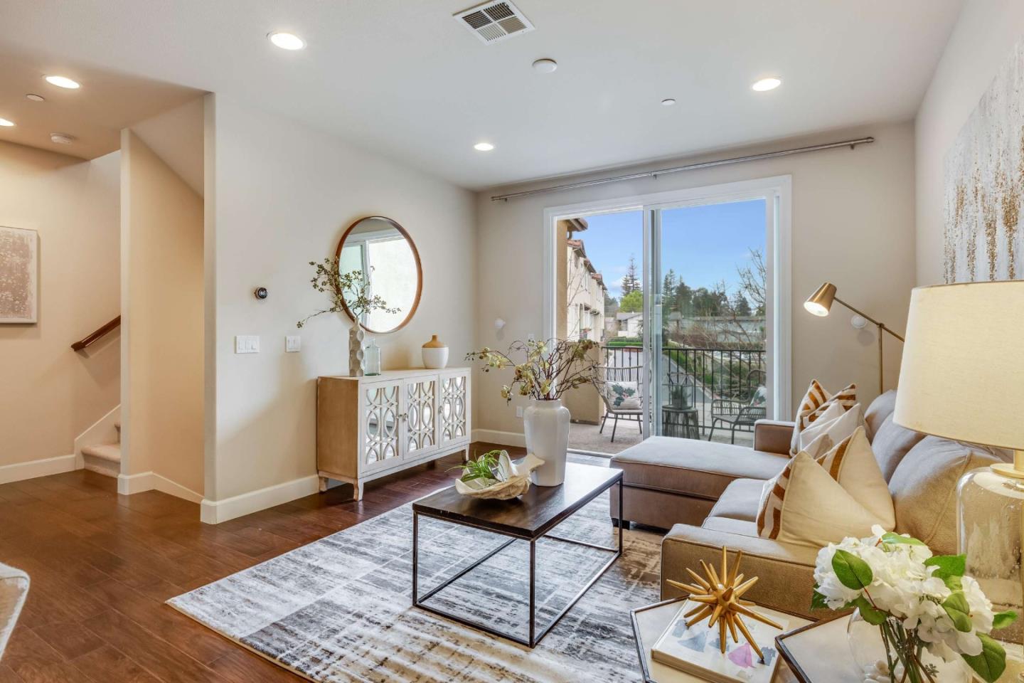 579 Holthouse Terrace Sunnyvale, CA 94087 - Photo 5 of 37 a living room with furniture a large window and wooden floor