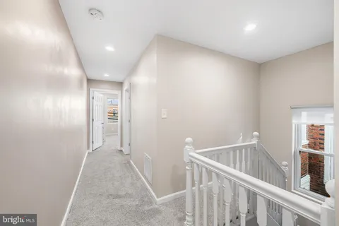 a view of a hallway with closet