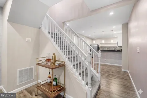 a white toilet sitting next to a shower