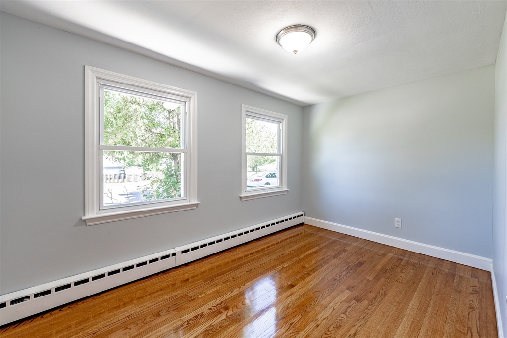 126 Lancaster Avenue West Springfield, MA 01089 - Photo 12 of 35 a view of a room with wooden floor and window