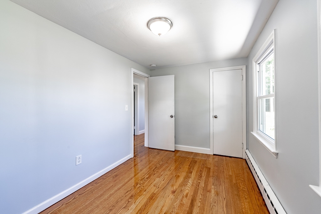 126 Lancaster Avenue West Springfield, MA 01089 - Photo 14 of 35 an empty room with wooden floor and windows