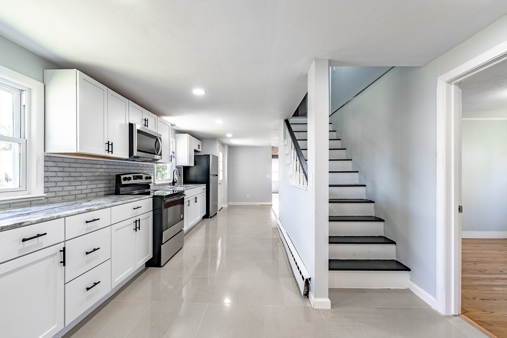126 Lancaster Avenue West Springfield, MA 01089 - Photo 18 of 35 a kitchen with granite countertop cabinets and steel stainless steel appliances