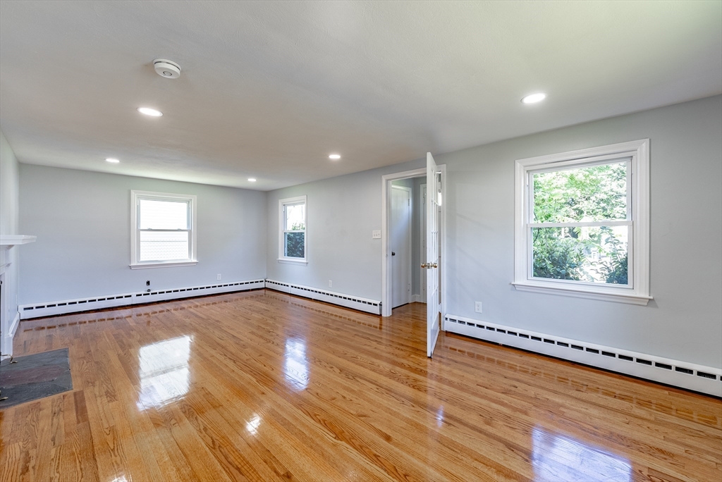 126 Lancaster Avenue West Springfield, MA 01089 - Photo 19 of 35 a view of an empty room with wooden floor and a window