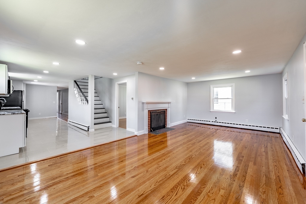 126 Lancaster Avenue West Springfield, MA 01089 - Photo 20 of 35 a view of a room with wooden floor and fireplace
