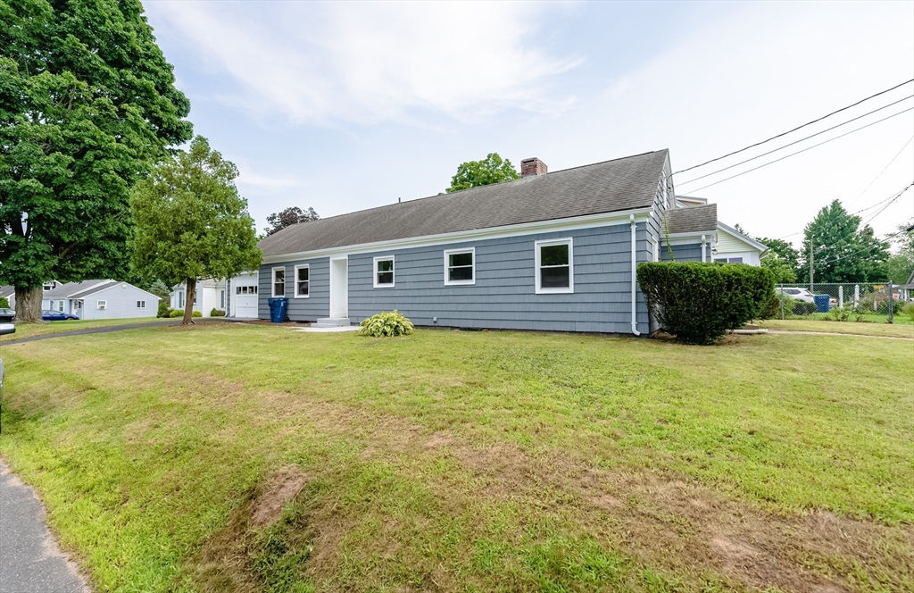 126 Lancaster Avenue West Springfield, MA 01089 - Photo 2 of 35 a front view of a house with a yard